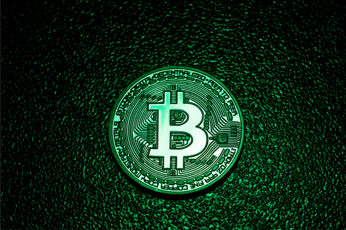 Bitcoin coin shaded green to tie in with the environmental issues
