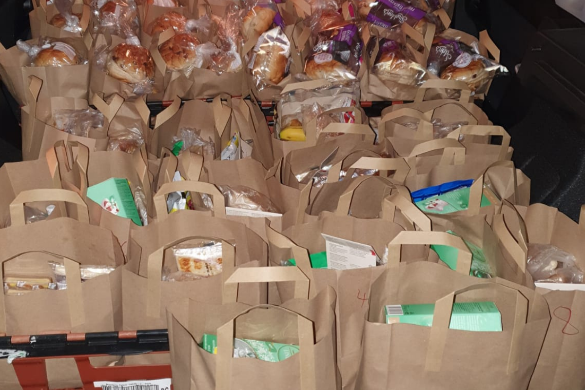 Many paper bags full of meals donated by Rob and Angels with support of Clarion Wealth Planning