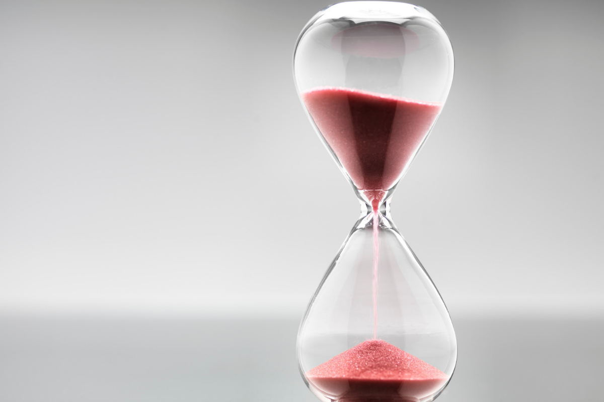 hourglass with red sand to denote patience