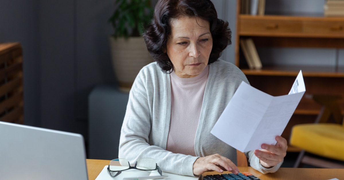 A woman making calculations.