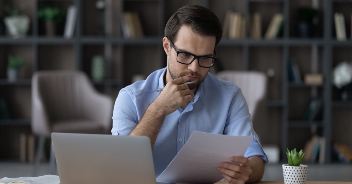 A man reviewing paperwork.