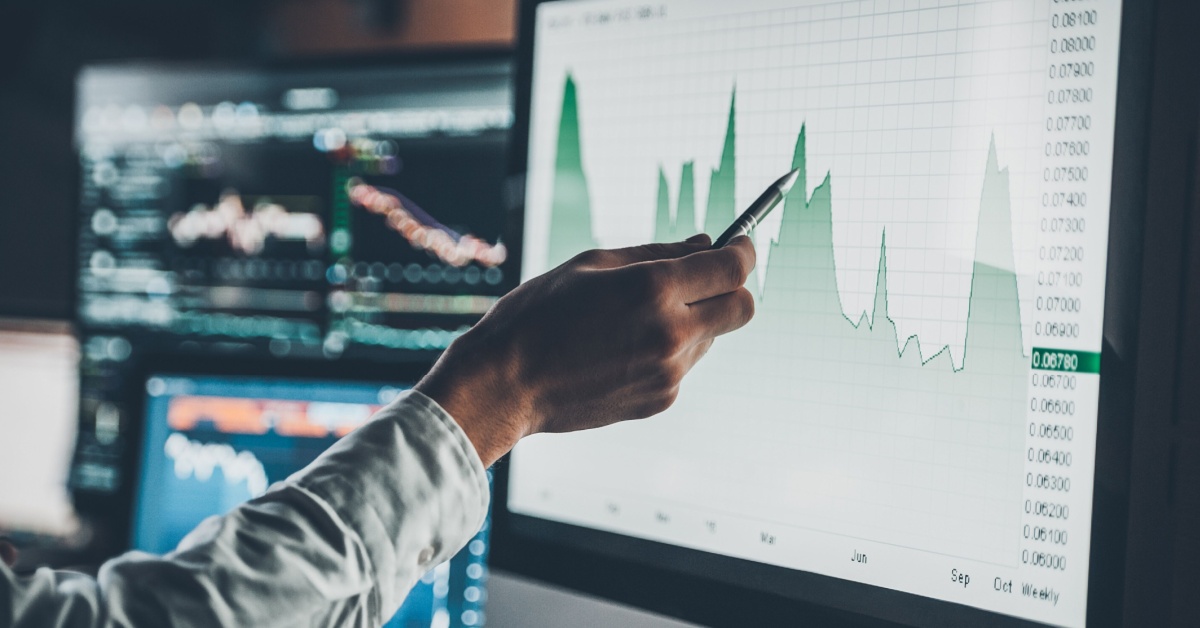 A person pointing to an index on a screen.