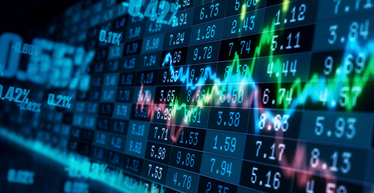 Stock market performance on a screen.