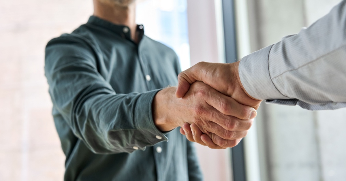 Two businesspeople shaking hands