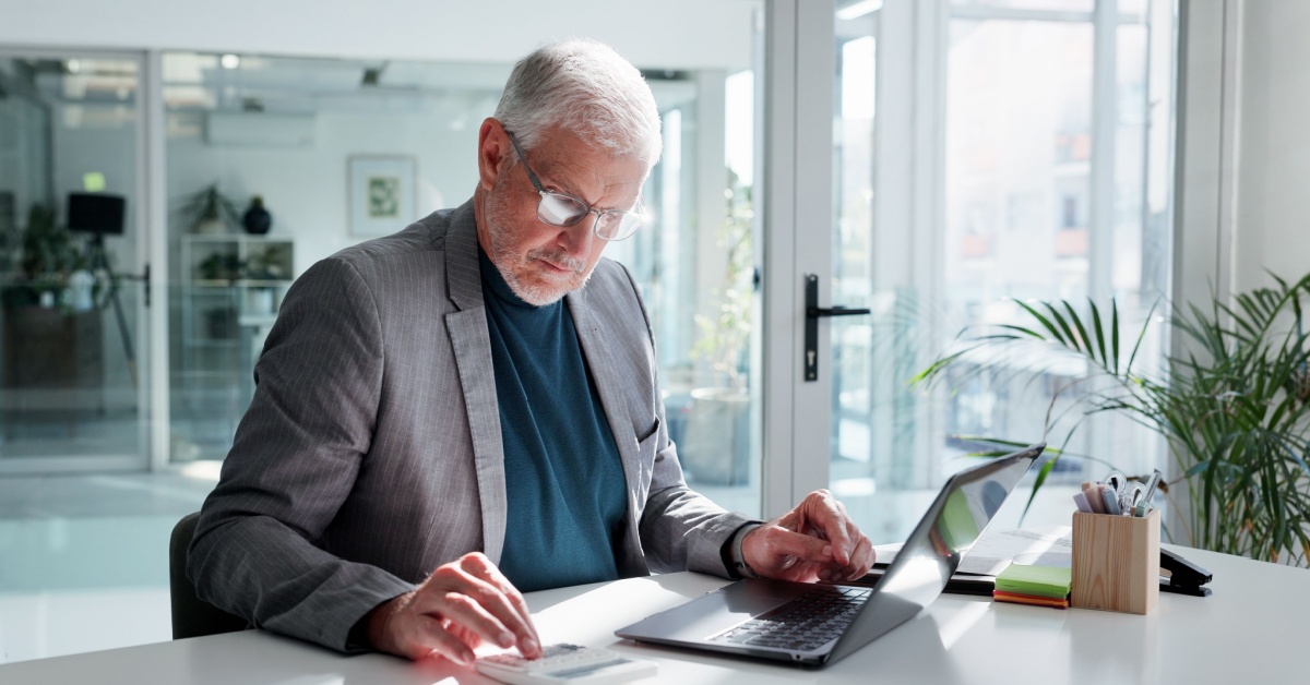 A businessman making calculations