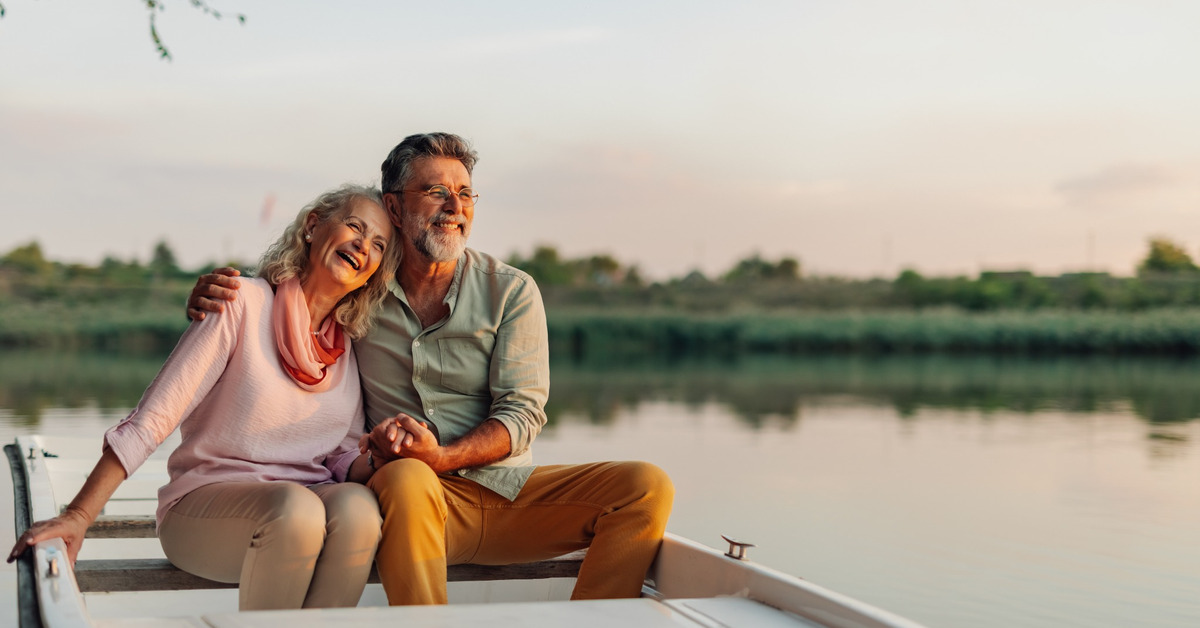 An older couple watching the sunset